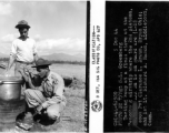 Testing soup at a field stove at the Tengchong airstrip where the 2nd Platoon, 704th AB AAA Battalion, is on guard are cook, Pvt. Clarence L. Braun, and 1st Lt. Richard B. Nason.  December 5, 1944.  Photo by T/Sgt. S. L. Greenberg. 164th Signal Photographic Company.  Passed by Emanuel Goldberg.