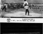 Chinese acrobatic group puts on show for Burma Road Engineers (BRE) members at the air strip, at Tengchong, China.  December 8, 1944.  Photo by T/Sgt. Greenberg. 164th Signal Photographic Company, APO 627.  Passed by William E. Whitten.