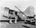 Unloadeding AAC equipment from C-47 at Tengchong airstrip.  December 14, 1944.  Photo by T/Sgt. S. L. Greenberg. 164th Signal Photographic Company, APO 627.  Passed by William E. Whitten.