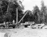 797th Engineer Forestry Company mill in Burma, loading logs for milling for bridge building along the Burma Road.  During WWII.