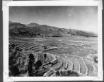 Scenes in Kunming, China, area during WWII: Terraced farmland, and boatmen waiting for commuter fares.