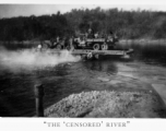 Trucks on ferry on river in Burma.  During WWII.  797th Engineer Forestry Company.