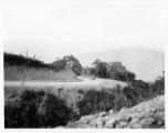 Truck carrying pipe on road in Burma.  During WWII.  797th Engineer Forestry Company.