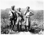 Local people in Burma near the 797th Engineer Forestry Company--three Kachin men with large knives.  During WWII.