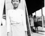 Local people in Burma near the 797th Engineer Forestry Company--a girl poses for the camera.  During WWII.