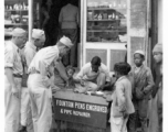 GIs of the 2005th Ordnance Maintenance Company, 28th Air Depot Group, at engraver stand, possibly in Barrackpore, India.