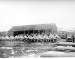 Canvas-shrouded anti-aircraft guns in Burma or India. 2005th Ordnance Maintenance Company, 28th Air Depot Group, WWII.