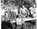 The boys hanging out on remains of fighter plane.  Leo Spearence (with pipe) in center, John Schuhart (far right).  Likely in Burma. 2005th Ordnance Maintenance Company,  28th Air Depot Group.
