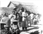 Open-air market in village near and American base is SW China. 22nd Bombardment Squadron, during WWII.