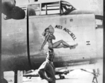Flyer standing with B-25 "MISS MITCHELL," in CBI during WWII.