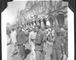 Radar mechanics Charles Klaes and Ashod Janigian among bustling crowds in Kunming, Yunnan, China. During WWII.