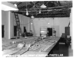 "Print Stripping" at photo lab of the 24th Mapping Squadron--laying out related photographic prints as they were photographed on the negatives. February 12, 1945.