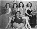 Ladies and tramp of a USO show in Gushkara, India, during WWII.