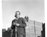 Enlisted man sings at a USO show in Gushkara, India, during WWII.