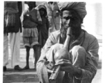 Snake charmer in India, during WWII.