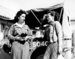 Alice Kim Chong (1909-1972) was one of Claire Chennault’s two female interpreters at Kunming between 1943 and 1945.  Here they are outside the HQ building at Kunming in 1943.  Eloise Witwer, Alice’s roommate and best friend, at left.  Alice Kim Chong (1909-1972) at right.