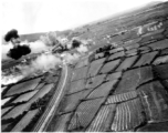 Low altitude bombing of railway near Van Trai Railroad Station, likely French Indochina. 