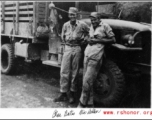 American GIs and transport truck roadside in the CBI during WWII: Charles Bates and Nic Dekker.