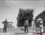 Man shoulders sheep-skin raft in northern China during WWII.