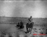 GIs on horses in northern China, carbines held at the ready. Edward Gable served in northern China.