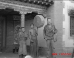 GI poses with monks or trainees at a Lamist temple in northern China during WWII.