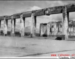 Bob Riese and friend explore remains of aircraft factory and hangers at the air base at Liuzhou, in 1945. The facilities at the base were first destroyed by the Chinese and Americans during retreat in the face of Ichigo during the fall of 1944, then may have been destroyed more by American bombardment during Japanese occupation, and possibly destroyed more by the Japanese as they retreated the area in 1945.