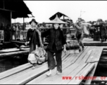 People crossing the floating bridge at Liuzhou during WWII.