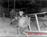 People transporting possessions in Guangxi province during WWII, possibly in preparation to fleeing in the face of the Japanese Ichigo campaign.