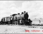 Allied gas train at the edge of the field, Liuzhou (Luichow), China Sept 1944, after a Japanese bombing raid, during WWII.