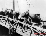 GIs line up to disembark ship on the way back to the US after the war. The ship is probably the SS Marine Raven.