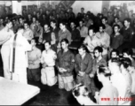 GIs have communion during church service on ship on the way back to the US after the war. The ship is probably the SS Marine Raven.