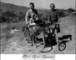 A western couple, "Mr. & Mrs. Muir" with child on bicycles in the Xiaguan/Dali area, near the outlet to Erhai Lake. During WWII.  This is the missionary couple Frank and Gladys Muir, and one of their two sons.