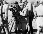 Chinese troops look at movie camera.