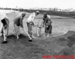 Chinese laborers working at an airbase somewhere in China.  Image from U. S. Government official sources.