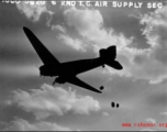 A US C-47 cargo plane drops supplies from the air. ...  10 CU...  2ND T.C. AIR SUPPLY SEC.