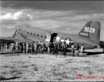 A C-47 (tail #349028) of the Air Transport Command (ATC) on the ground with Chinese laborers in the foreground.