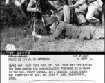 (L-R) Maj. Wang Cheh Tso, Lt. Col Tang Wei Tan firing the 60mm mortar for demonstration purposes at a class in the general staff school, ITC, Kunming, China, under the direction of 1st. Lt. John W. Lee, Washington, Iowa. 23 September 1944.