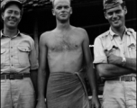 Three GIs pose for the camera--including one in a bath towel--in the CBI during WWII.    From the collection of David Firman, 61st Air Service Group.