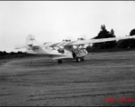 A PBY named 'Web Foot Maggie' in the CBI, tail number #433977.