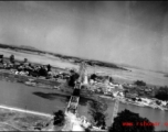 An aerial photograph of a railway bridge being bombed by the 491st Bomb Squadron in Yunnan or Indochina, during WWII.