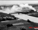 An aerial photograph during battle in the CBI--The approach to a railway bridge in SW China or Indo-China has been bombed by a plane of 491st Bomb Squadron, 341st Bombardment Group.