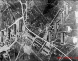 An aerial reconnaissance photograph shAn aerial reconnaissance photograph showing an enemy base in the midst of bombing, and zig-zag trenches on the ground, in the CBI during WWII. an enemy base in the midst of bombing.