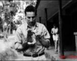 A young GI and his pet at Yangkai base, Yunnan, during WWII.