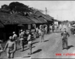 GI Joe and Chinese soldiers on a village street, probably outside of Yangkai base, Yunnan.