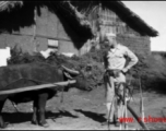 An American explores a village, probably at Yangkai, during WWII.