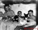 Hanging out, probably at Yangkai base, Yunnan.  Jay Rosencrantz, on the right, holds pet 'Clarance'.  Although called to be men at war, these soldiers were still young, and a boy's best friend was still a comfort and friend even during war.  Joseph Siana in middle.