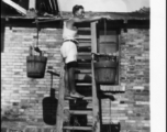 "Filling water buckets for showers" at an American air base in the CBI.