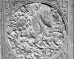 A carved wood panel, usually part of a door or partition.  In Yunnan or Guangxi province.