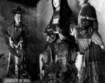 Statues inside a Buddhist temple in Yunnan, China. During WWII.