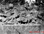 Carvings on a gravestone in Yunnan province, China.